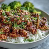 Forkful of Korean-Style Ground Turkey served over fluffy white rice, ready for a busy weeknight dinner.